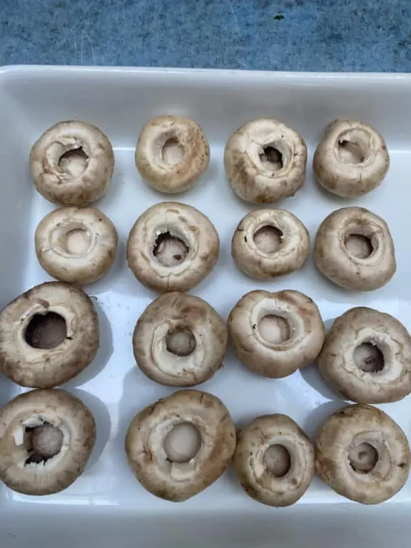 prepping button mushrooms for my stuffed mushroom recipe